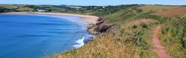 heading to Freshwater East, Ruth hiking the Wales Coast Path, Pembrokeshire