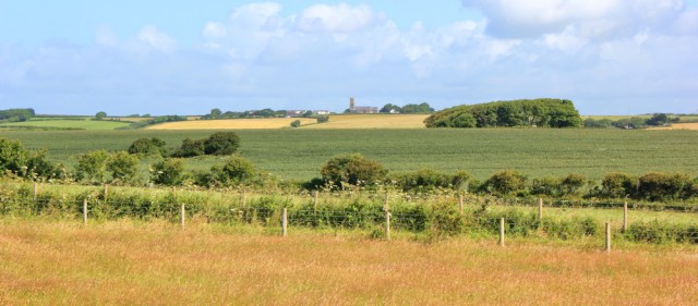 06 St Twynnells in distance, Ruth hiking in Wales