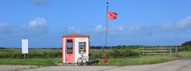14 Linney checkpoint, with bicycle, Ruth walking past Castlemartin Ranges
