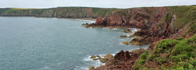 15 red rocks, Ruth walking the Pembrokeshire Coast Path
