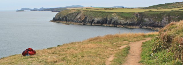 16 climbing sack, Ruth walking towards Caerfai Bay, St Davids