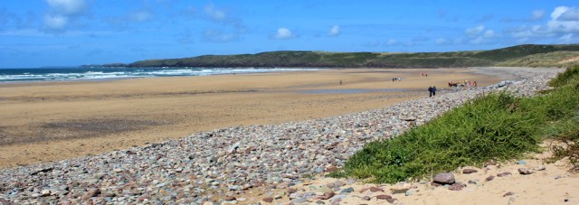 Ruth Livingstone walking across Freshwater West