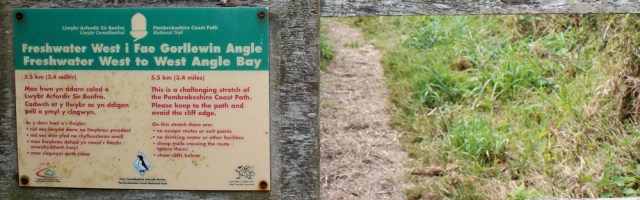 warning sign, Ruth hiking from Freshwater West to West Angle Bay