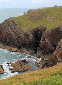 seat on cliff, Ruth hiking in Wales