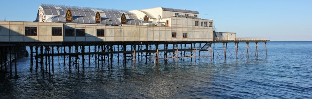 03 sad pier, Aberystwyth, Ruth trekking on the Ceredigion Coast Path