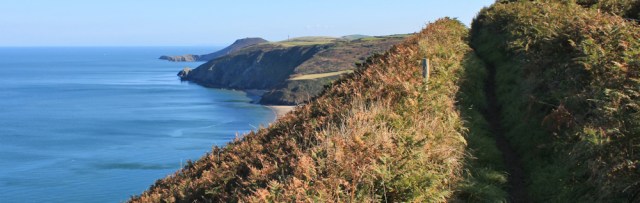 10 looking towards Llangrannog, Ruth hiking in Wales