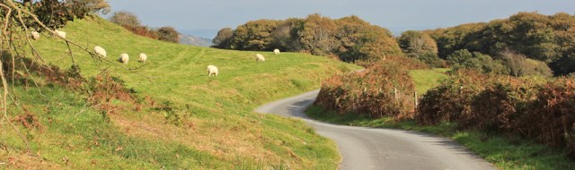 17 climbing the minor road, Ruth trekking the Wales Coast Path