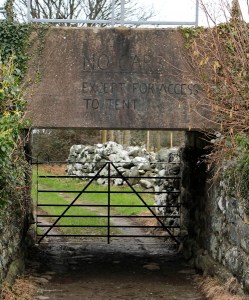 no cars sign, Ruth walking under railway bridge, Wales Coast Path