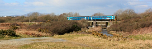 15 train crossing, Ruth walking the Wales Coast Path