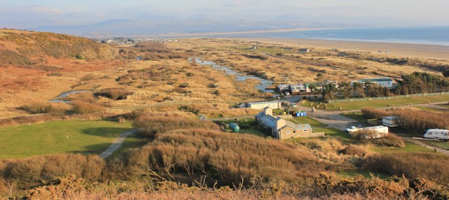 a18 looking down on Black Rock Sands, Ruth hiking the Wales Coast Path