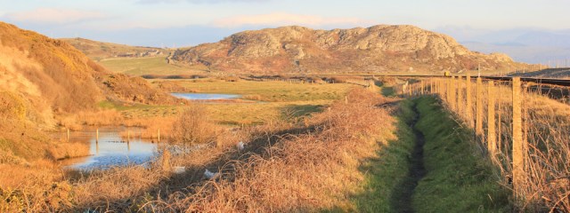a22 looking back, Ruth on the Wales Coast Path, Criccieth