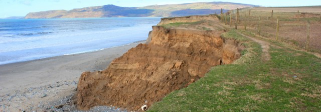 06 walking on crumbling cliffs, Ruth hiking in Wales