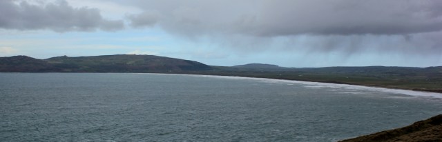 15 rain over Hell's Mouth, Ruth hiking to Porth Neigwl