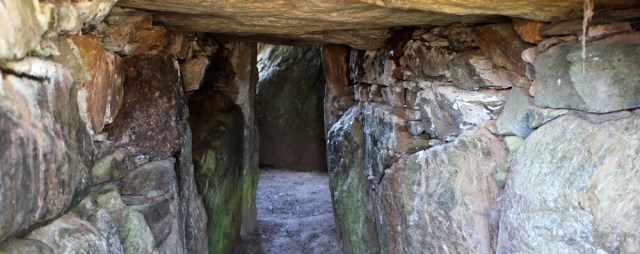 07 inside cairn chamber, Ruth in Brycelli Ddu, Anglesey