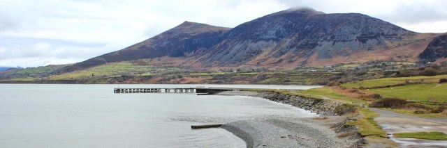 07 Trefor Pier, Ruth walking along the Wales Coast path