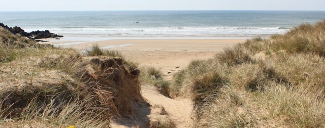 17 Aberffraw Sands, Ruth walking the Isle of Anglesey coastal path