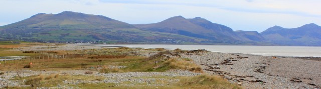 29 view back to Yr Eifl, Ruth walking the coast near Caernarfon