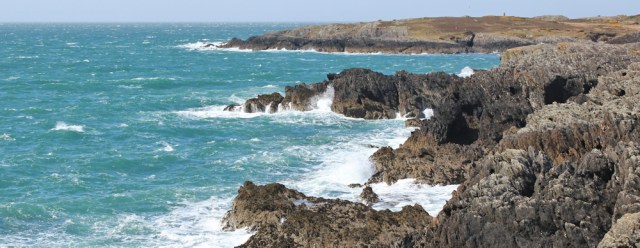 a03 rugged coastline, Ruth walking towards Borthwen, Anglesey
