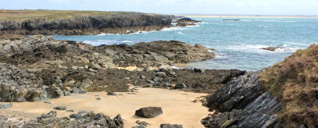 a08 over Cymyran Bay to Traeth Cymran, Ruth on Holy Island, Wales