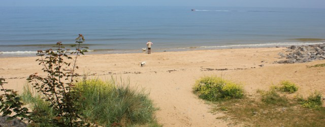 21 walking the coast path, Ruth at Traeth Benllech