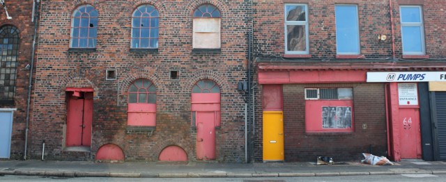 17 old warehouses, Ruth walking through Bootle, Liverpool Docks