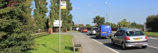 46 Birchwood bus stop, Ruth walking near Preston