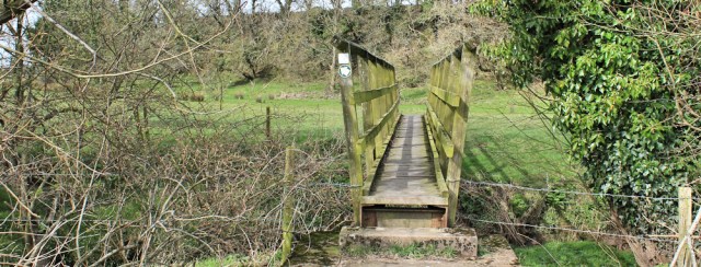 19 footbridge near Cargo, Ruth hiking to Gretna