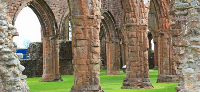 02 arches inside Sweetheart Abbey, Ruth walking in Dumfries and Galloway