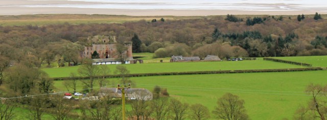 17 view down to Caerlaverock Castle, Ruth walking the Scottish coastline