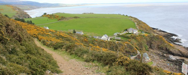 a10 above Blackneuk Craigs,Ruth walking the coast in Dumfries and Galloway