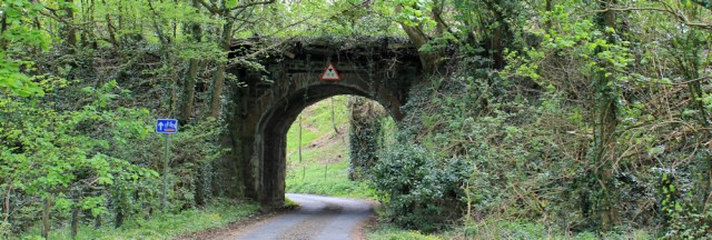 06 under old railway bridge, Ruth hiking to Garlieston
