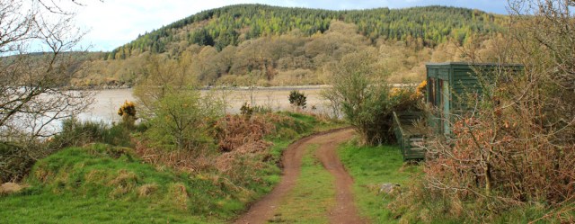 09 huts on Glen Isle, Ruth hiking in Dumfries and Galloway