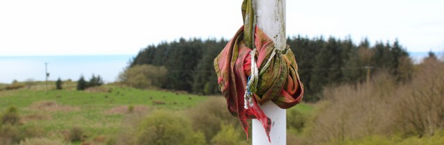 19 mouldy red flag, Kirkcudbright ranges, Ruth hiking the coast in Scotland