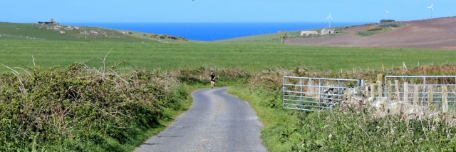 06 jogger near Muntloch Fell, Ruth's coastal walk, The Rhins, Scotland