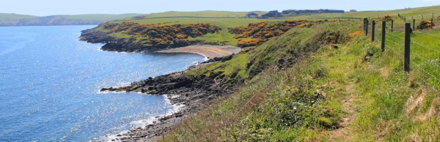 14 along cliffs to East Tarbet, Ruth walking the Mull of Galloway Trail, Scotland