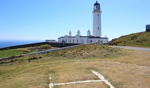 26 a lighthouse, Ruth walking the Mull of Galloway Trail, Scotland