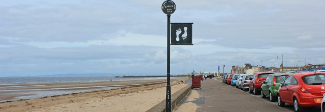 20 footprint markers, Ayr promenade, Ruth hiking the coast of Scotland