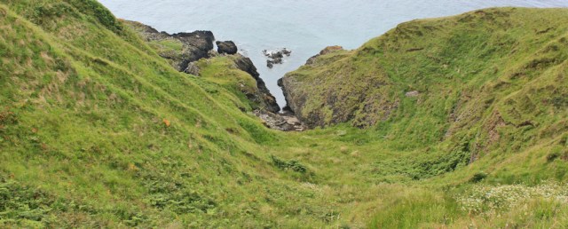 27 cove below Downan Point, Ruth hiking the Ayrshire Coastal Path, Scotland