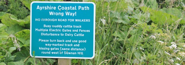 32 Ruth hiking the Ayrshire Coastal Path, Scotland, wrong way sign