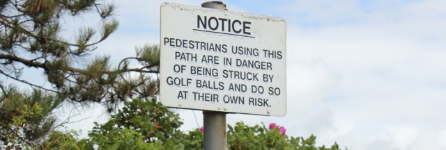 46 golf ball warning, Ruth hiking the Ayrshire Coastal Path