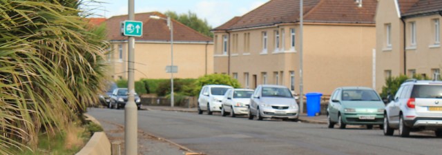 65b Troon sign, Ruth hiking the Ayrshire Coastal Path
