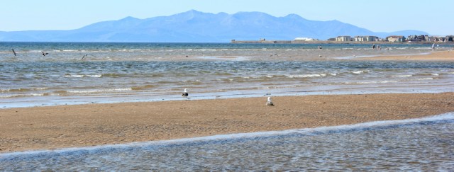 28 Arran from Stevenston, Ruth hiking the Scottish coast