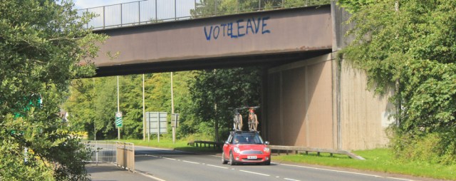 36 vote leave sign, Ruth hiking the Ayrshire Coastal Path, Scotland