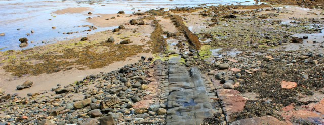 38 rock formations, Whiting Bay, Ruth hiking the Arran Coastal Way, Scotland
