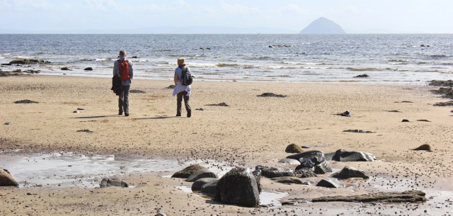 25 hikers on the beach, Arran Coastal Way, Ruth hiking in Scotland