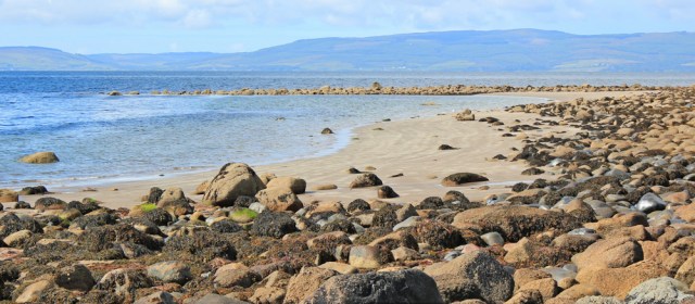 25 sand and rocks, Ruth hiking the coast of Isle of Arran