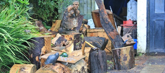 10 wood sculptor and carver, Ruth walking through Corrie, Isle of Arran