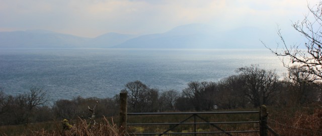 05 hazy Arran, Ruth hiking the Kintyre coast, Scotland