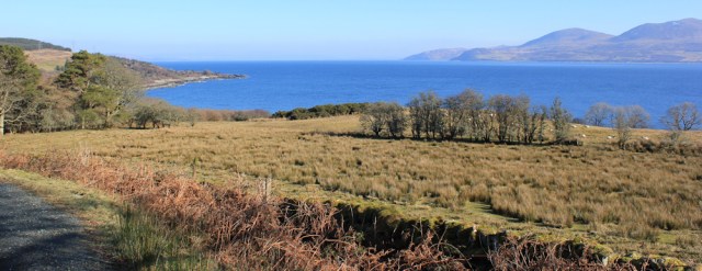 09 view over to Arran, Ruth hiking the coast of the Kintyre Peninsula