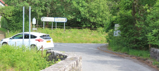 74 road fork in Kilninver, Ruth hiking the coast of Scotland